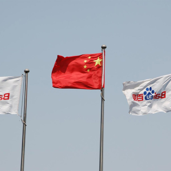 FILED - 22 May 2014, China, Bejing: The Chinese national flag is flanked by the company flags of Chinese internet search engine Baidu swaying in the wind at the Baidu's headquarter. Photo: picture alliance / dpa picture alliance / dpa FILED - 22 May 2014, China, Bejing: The Chinese national flag is flanked by the company flags of Chinese internet search engine Baidu swaying in the wind at the Baidu's headquarter. Photo: picture alliance / dpa picture alliance / dpa