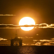 27 April 2020, Scotland, Kirkcaldy: The sun rises behind a redundant oil platform moored in the Firth of Forth near Kirkcaldy. Photo: Jane Barlow/PA Wire/dpa Jane Barlow/PA Wire/dpa