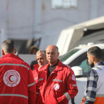 03 February 2026, Palestinian Territories, Gaza: Members of the Red Crescent wait as patients and their companions aboard the ambulances at the Al-Amal Hospital Omar Ashtawy/APA Images via ZUMA / DPA
