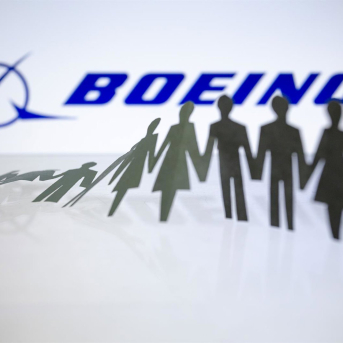 11 October 2024, Paraguay, Asuncion: Boeing logo is displayed behind cut out paper figures chain. Photo: Andre M. Chang/ZUMA Press Wire/dpa Andre M. Chang/ZUMA Press Wire/d / DPA 11 October 2024, Paraguay, Asuncion: Boeing logo is displayed behind cut out paper figures chain. Photo: Andre M. Chang/ZUMA Press Wire/dpa Andre M. Chang/ZUMA Press Wire/d / DPA