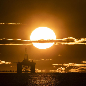 27 April 2020, Scotland, Kirkcaldy: The sun rises behind a redundant oil platform moored in the Firth of Forth near Kirkcaldy. Photo: Jane Barlow/PA Wire/dpa Jane Barlow/PA Wire/dpa