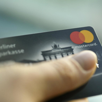 FILED - 22 January 2019, Berlin: A person holds a Mastercard credit card. Photo: Fabian Sommer/dpa Fabian Sommer/dpa