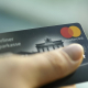 FILED - 22 January 2019, Berlin: A person holds a Mastercard credit card. Photo: Fabian Sommer/dpa Fabian Sommer/dpa