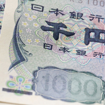 FILED - 19 February 2016, Hamburg: A view of bank notes of the Japanese currency Yen lying on a table. Japan's central bank is issuing a new banknote series for the first time in 20 years. Photo: picture alliance / dpa picture alliance / dpa