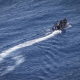 A boat with migrants on board in the waters of the Italian island of Lampedusa Oliver Weiken/Dpa