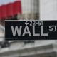 03 April 2020, US, New York: A Wall street sign is hanged near the facade of the New York Stock Exchange as stocks fall after the US reports job losses in March and on coronavirus fears. Photo: Bryan Smith/ZUMA Wire/dpa Bryan Smith/ZUMA Wire/dpa
