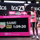 26 April 2026, United Kingdom, London: Sabastian Sawe stands next to the timer after setting a new world record during the 2026 TCS London Marathon. Photo: John Walton/PA Wire/dpa John Walton/PA Wire/dpa