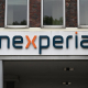 FILED - 25 August 2025, Hamburg: The logo of the semiconductor manufacturer "Nexperia" hangs above the entrance to the company building. Photo: David Hammersen/dpa David Hammersen/dpa