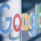 FILED - 16 August 2022, North Rhine-Westphalia, Cologne: A lettering with the Google logo is stuck on a glass pane in the press center of Koelnmesse. Photo: Rolf Vennenbernd/dpa Rolf Vennenbernd/dpa