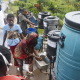 MPONDWE, May 24, 2026  -- A health officer (L, in white) directs inbound passengers to wash their hands at Mpondwe border point, western Uganda, May 23, 2026.    Nicholas Kajoba / Xinhua News / Europa Press / Con