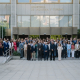 Los participantes en el acto, ante la sede del Ministerio de Industria