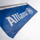 FILED - 03 May 2017, Bavaria, Munich: A flag with the Allianz logo flies before the start of a general meeting of the insurance group in the Olympic Park. Photo: Alexander Heinl/dpa Alexander Heinl/dpa