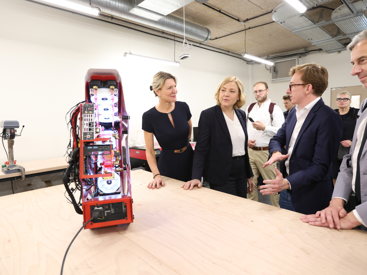 Sophie Viger, coding school 42's Director, left, and Henna Virkkunen, center, durign a visit to coding school 42, in Paris, France.