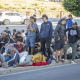 Migrantes esperan haciendo cola para ser atendidos por servicios de acogida en Ceuta Marcos Moreno - Europa Press