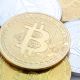 FILED - 10 November 2023, Berlin: Bitcoin (C) and Ethereum coins are arranged on a table. Photo: Fernando Gutierrez-Juarez/dpa Fernando Gutierrez-Juarez/dpa