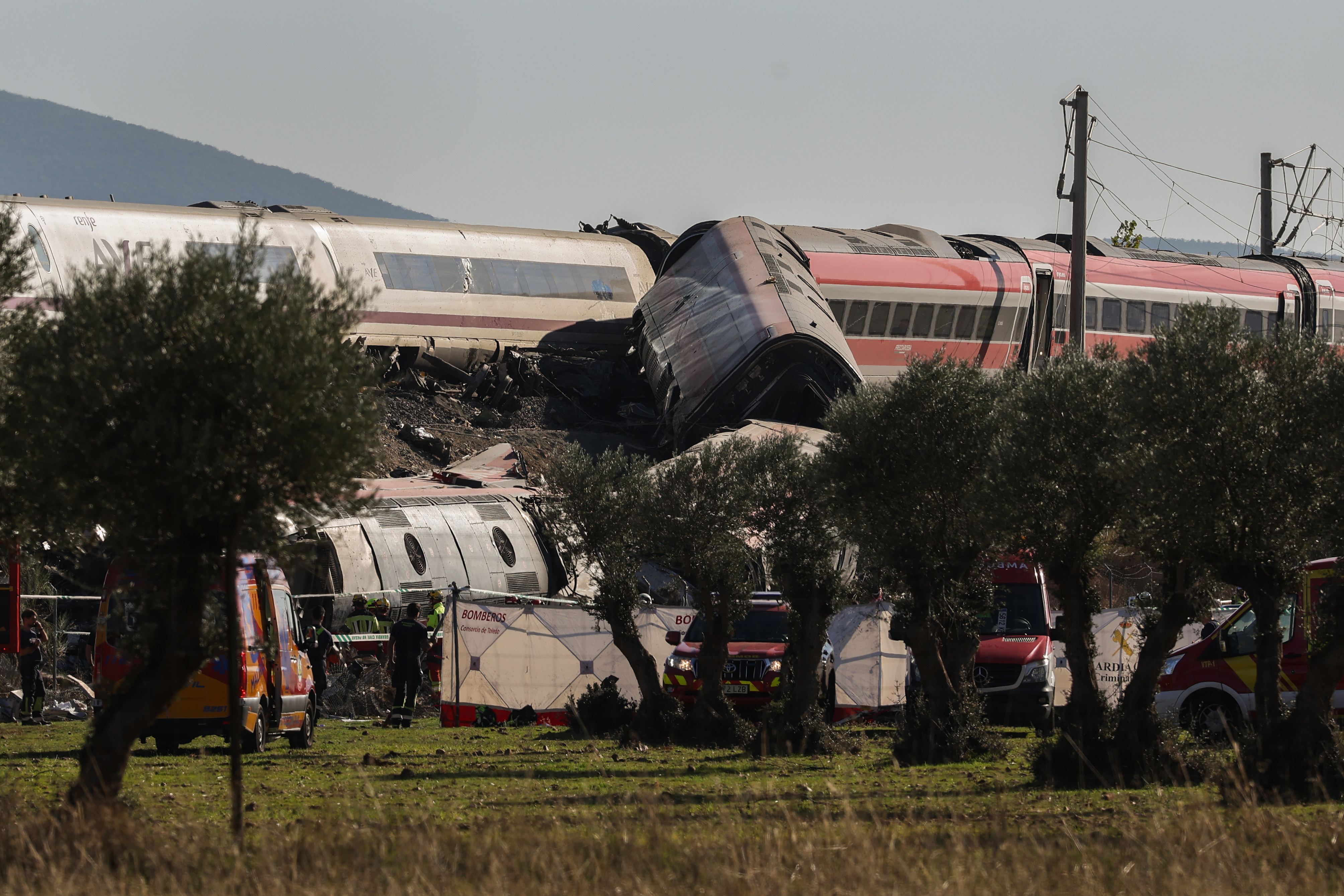 Emergency services work at the scene of the Urda accident