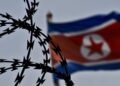 Archivo - Una bandera de Corea del Norte ondea tras una concertinaEuropa Press/Contacto/Chris Jung - Archivo